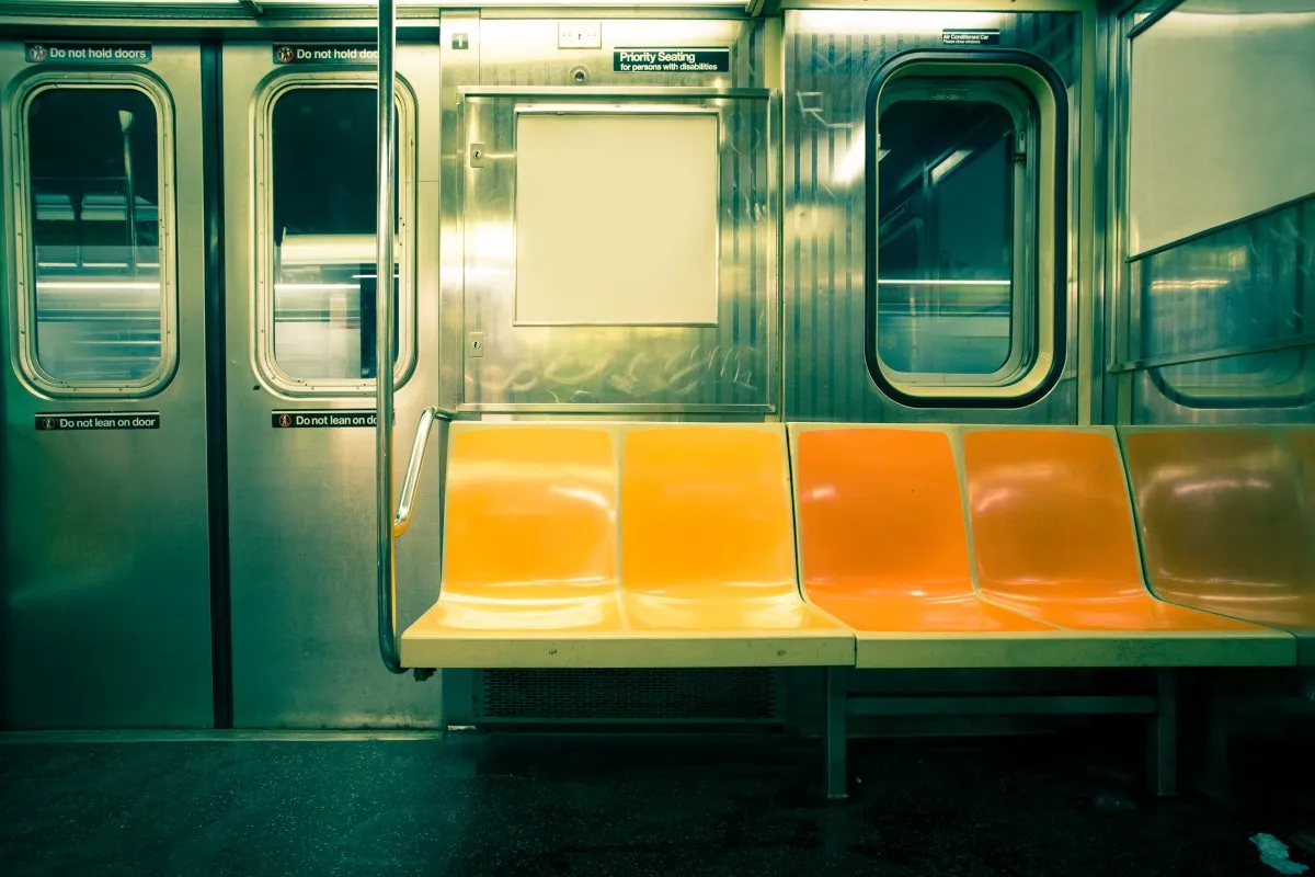 Photo from the inside of an empty NYC subway car