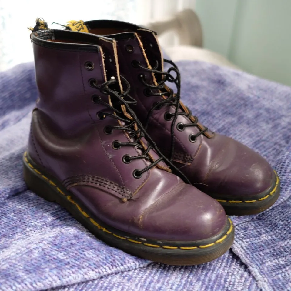 Photo of worn purple Doc Marten boots