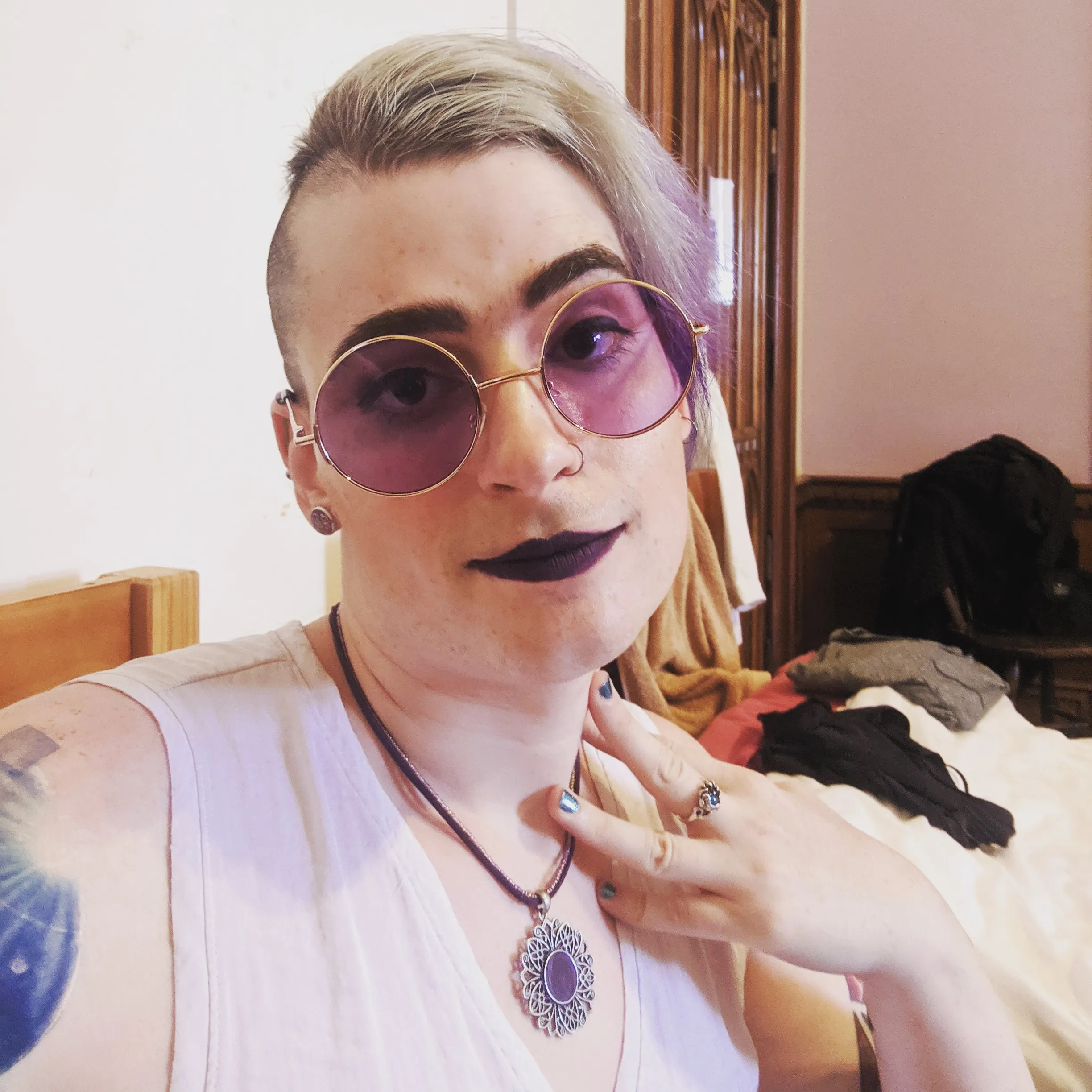 Photo of me in my costume with big purple glasses